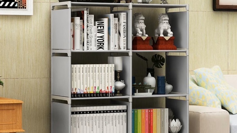 Grey bookshelves filled with knick knacks and books