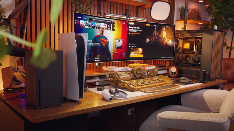 Gamer desk setup with PS5, Xbox, and PC gaming computer
