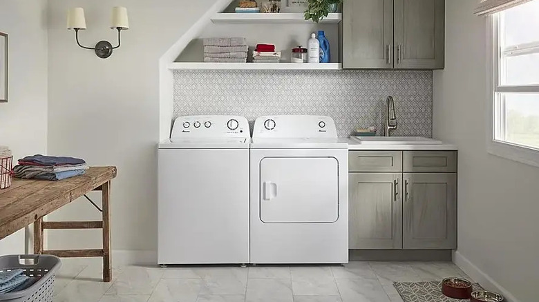 Amana washer beside matching dryer in laundry room