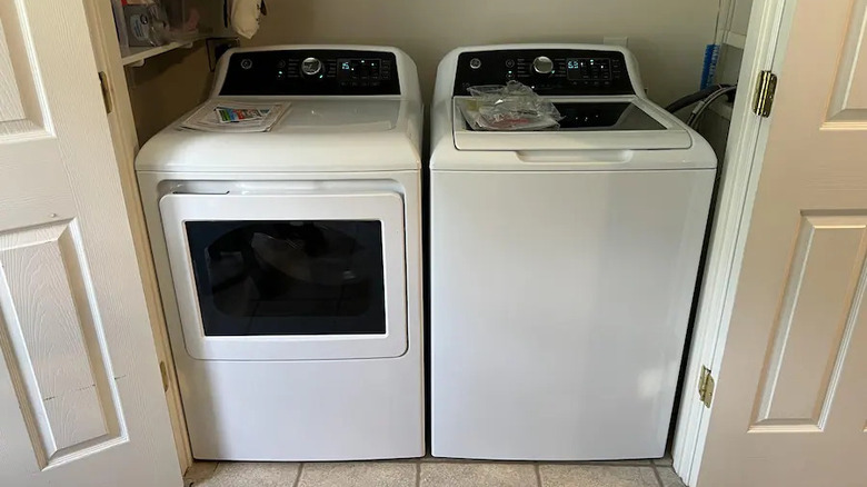 Customer image of GE washer and dryer tucked into customer closet