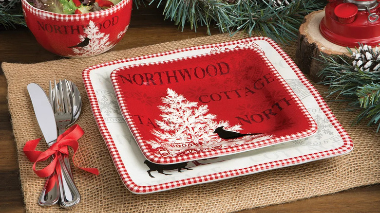 A red and white modern holiday dinnerware set with the words "Northwood Cottage" detailed across the surface.