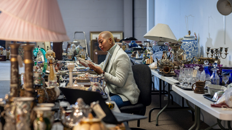 Someone examining the items at a thrift store
