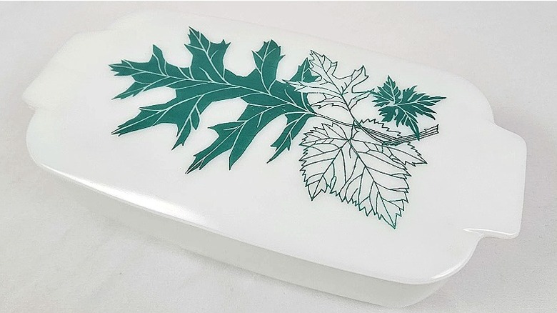 Green Oak Leaf 505B loaf pan from Pyrex against a light gray background