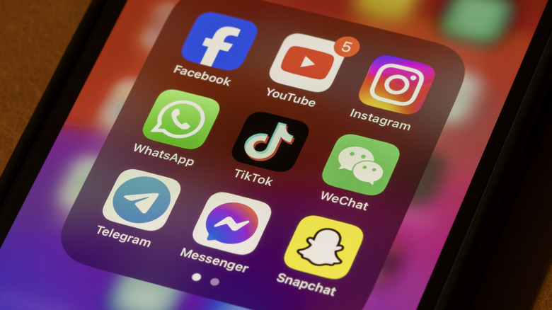Phone screen showing several social media apps