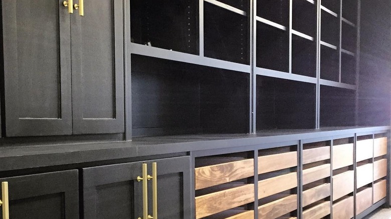 black cabinet unit with wood drawers