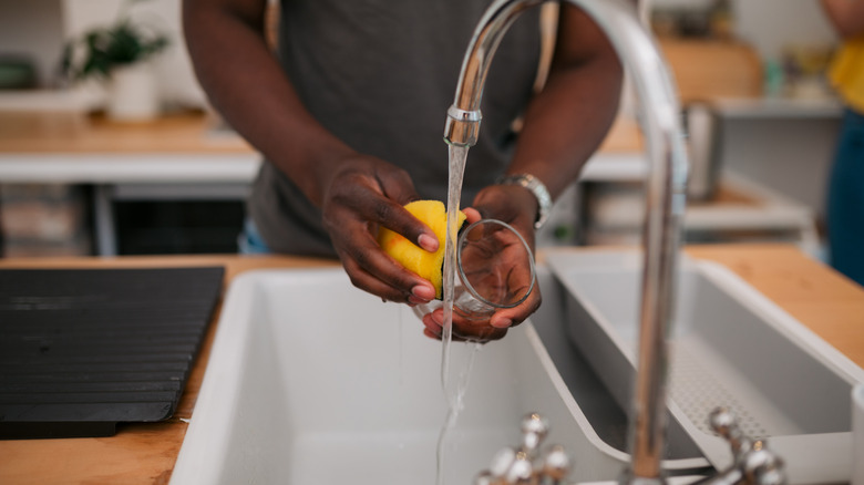 Man washing dishes