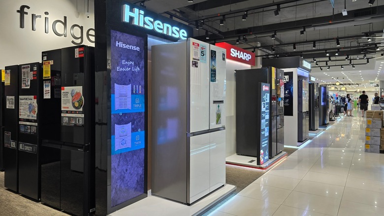 Rows of refrigerators at an appliance store