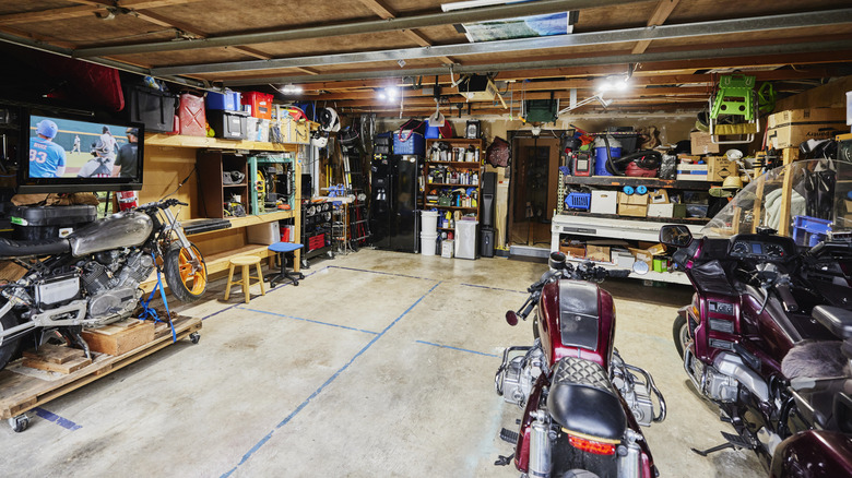 A garage with tools and motorcycles