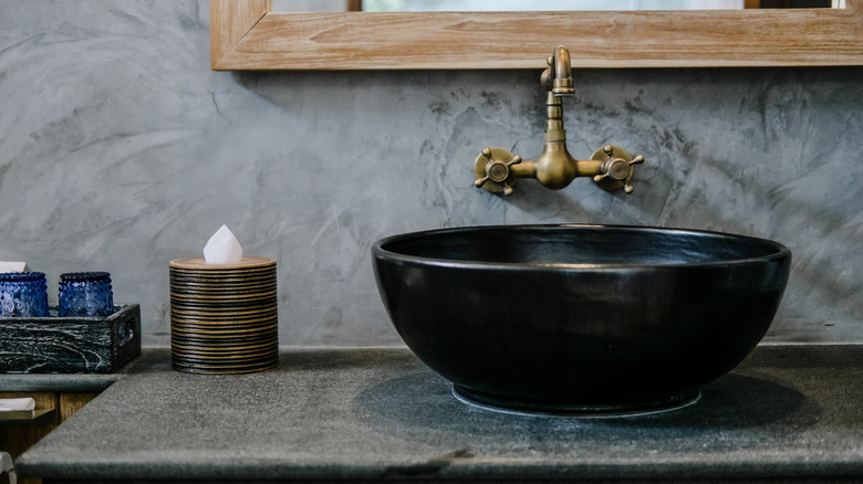 brass faucet in bathroom