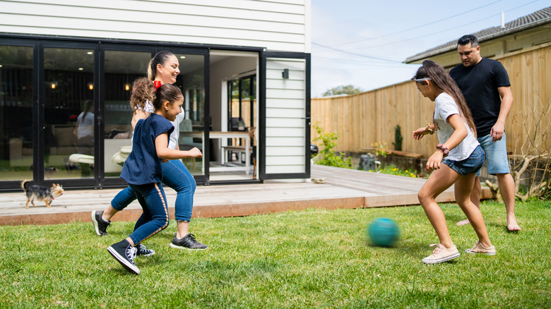 Family playing in a yard