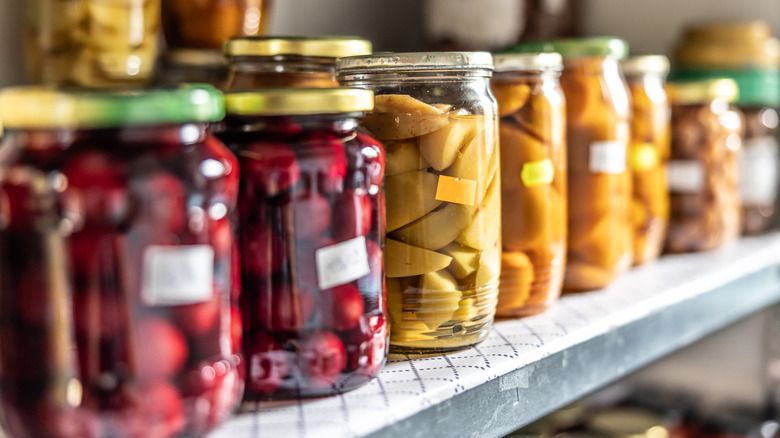 Line of filled glass jars with stickers