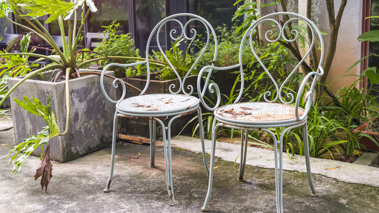 Rusted chairs in garden