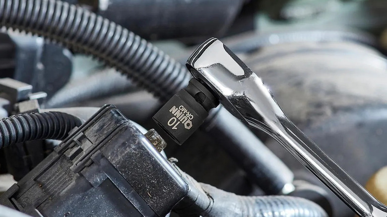 Loosening a damaged bolt with Harbor Freight's Quinn bolt extractor socket