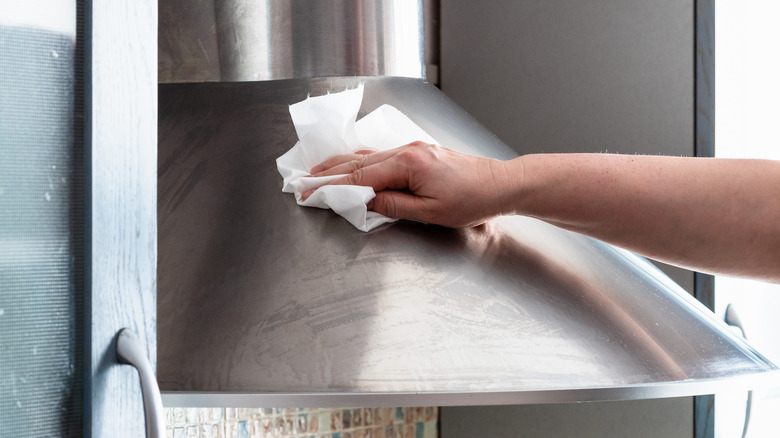 Wiping down a range hood