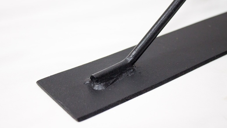 The somewhat dull blade of a new 12-gauge weed cutter by Bully Tools.