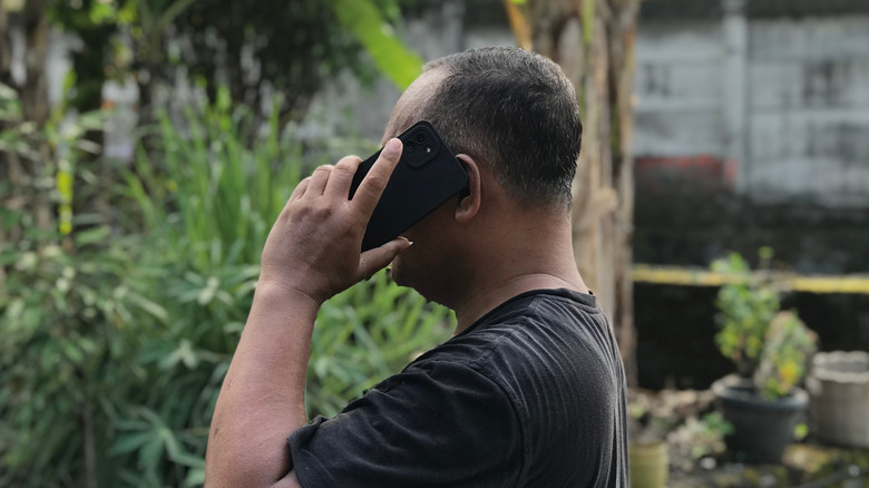 man on the phone in the garden