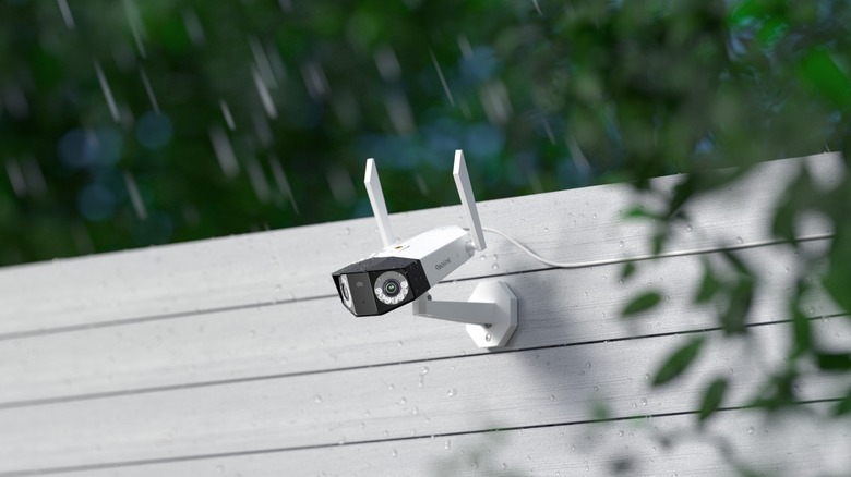 A Reolink Duo 3 Camera on fence in the rain