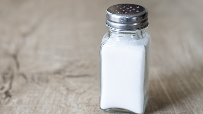 Salt shaker sitting on a table