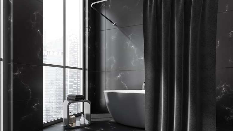 Modern neo-industrial bathtub with a shower curtain