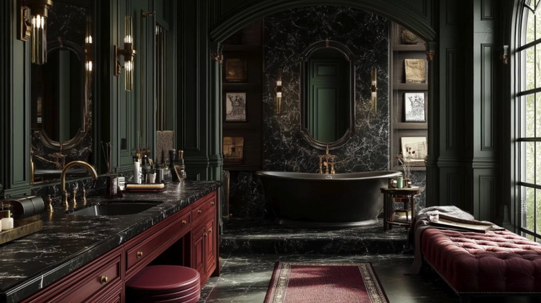 A bathroom featuring the dark academia style with marble feature wall and black soaking tub.