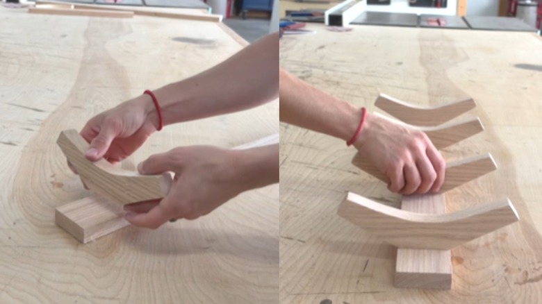 demonstrator adding hooks to backerboard