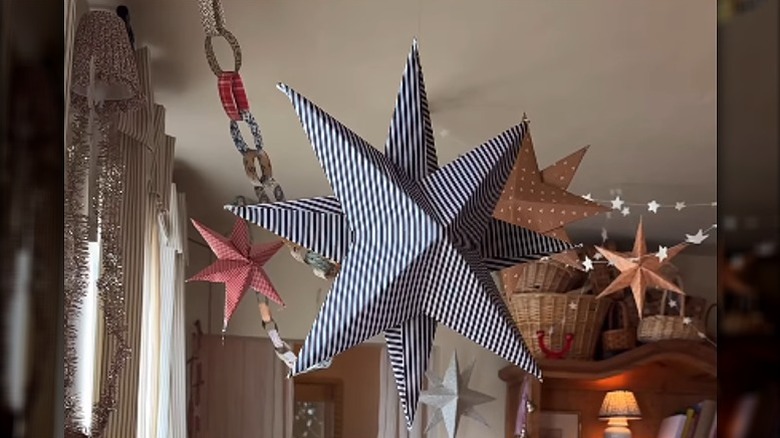 Fabric-covered stars hanging in a living room