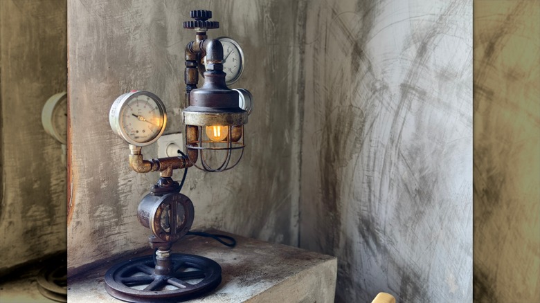 A steampunk-style table lamp made of wires and pipes.