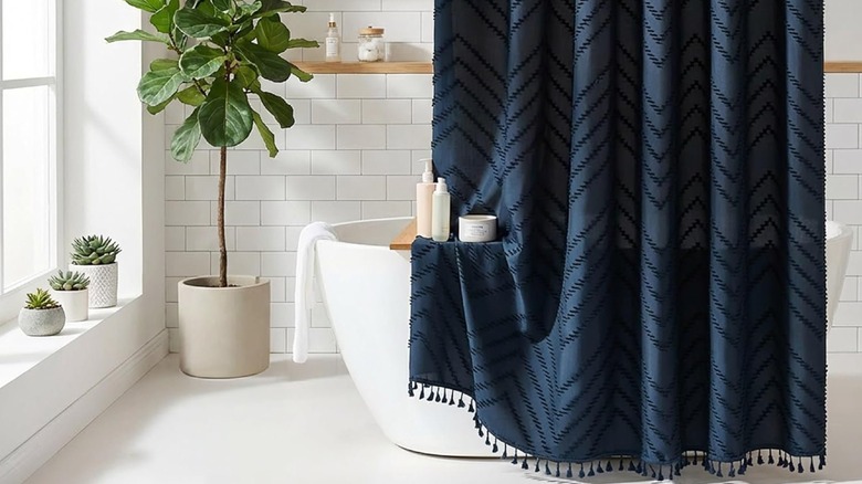 A white shower curtain with visible texture.