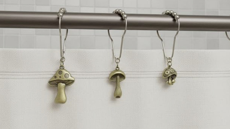 Mushroom pendant shower curtain rings in bathroom