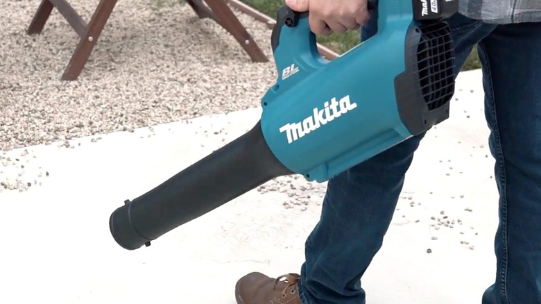Makita cordless blower being held by a man