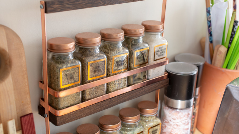 A spice rack filled with assorted spices