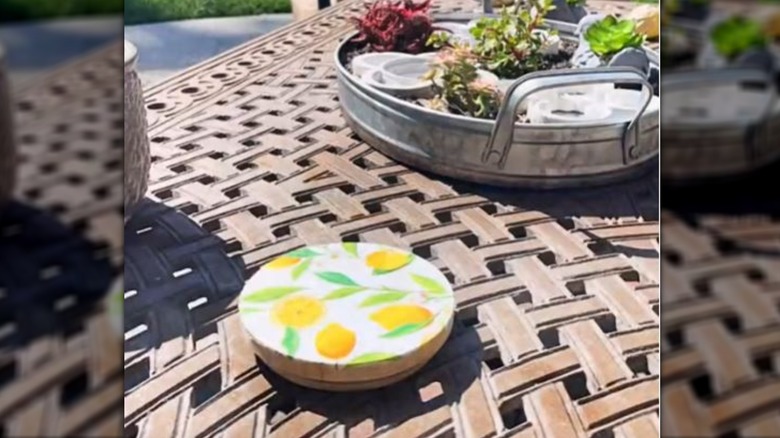 Coaster with lemon print on outdoor table