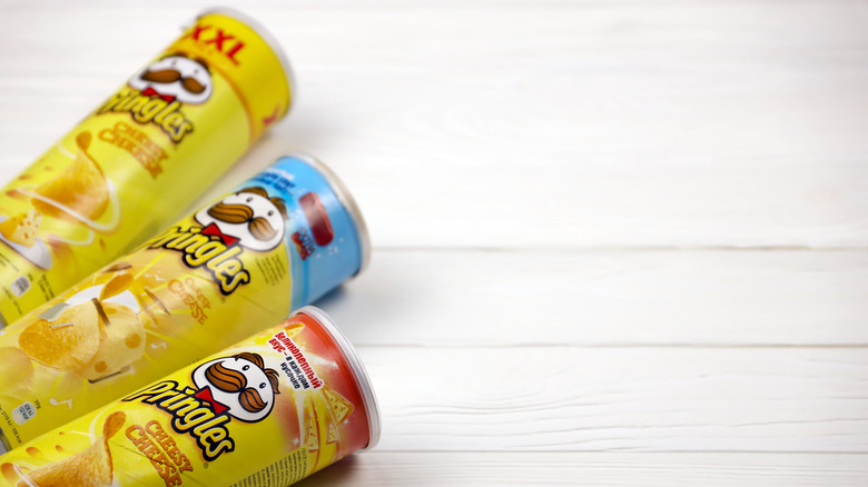 Three pringles cans on a table