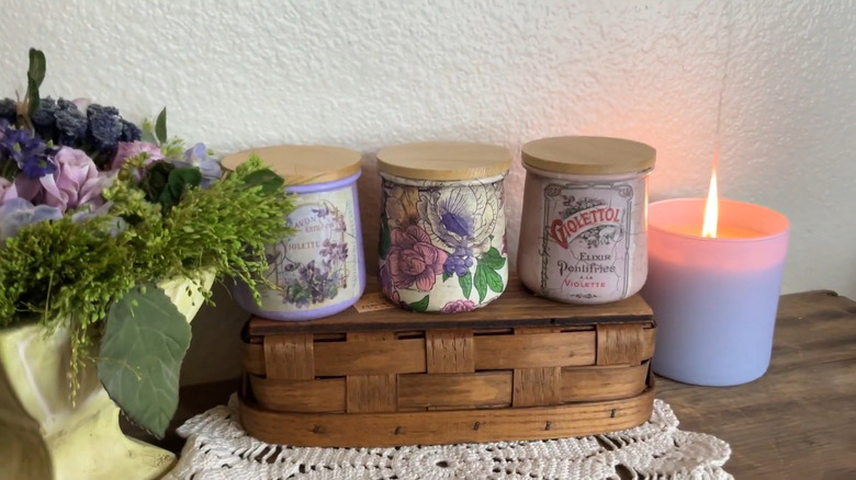 A collection of decoupaged yogurt glass jars in vintage style