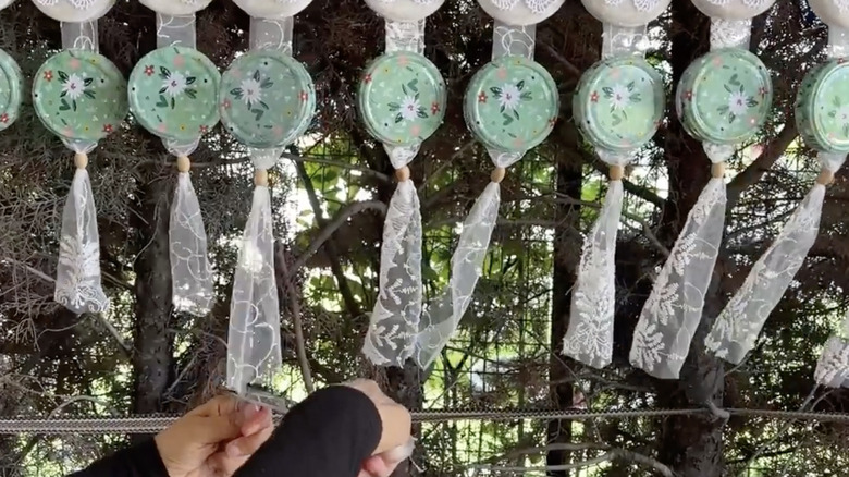 Trimming the lace on a DIY jar lid privacy screen