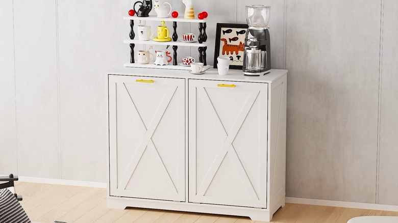 Laundry-cabinet-turned-coffee-station with cups and coffee on it