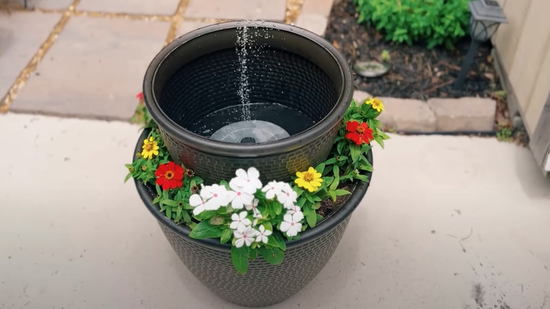 DIY garden fountain with flowers