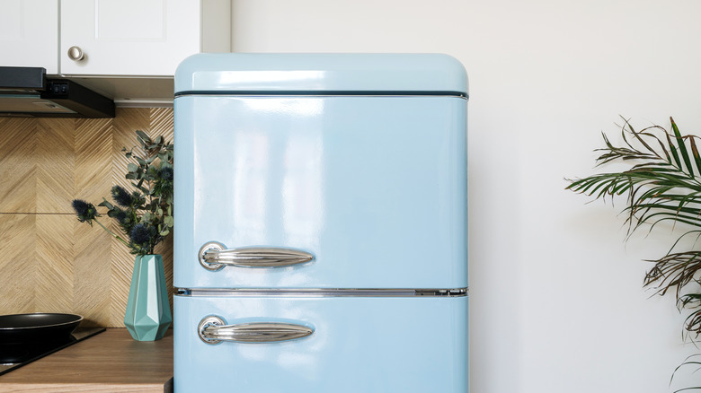 A retro baby blue fridge makes a kitchen stylish.