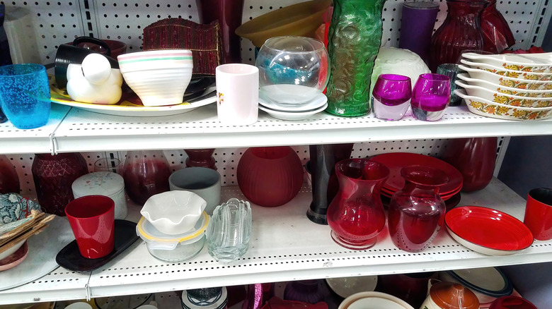 Thrift store shelves filled with glassware