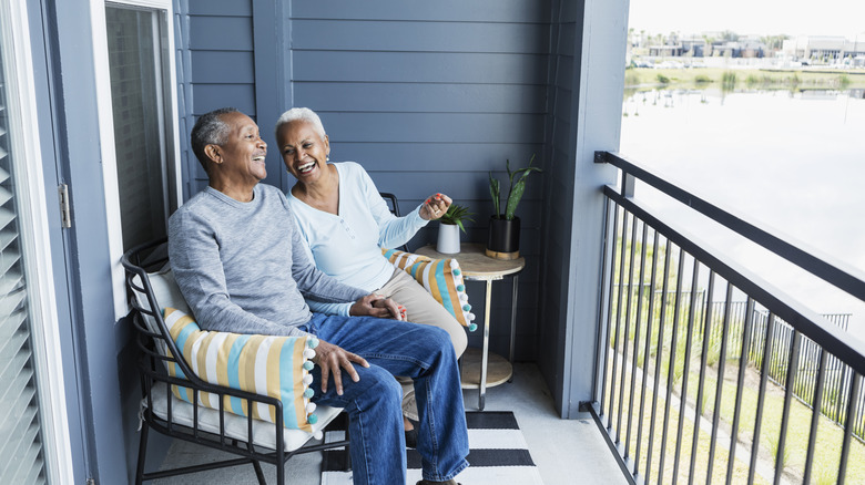 couple sit on porch