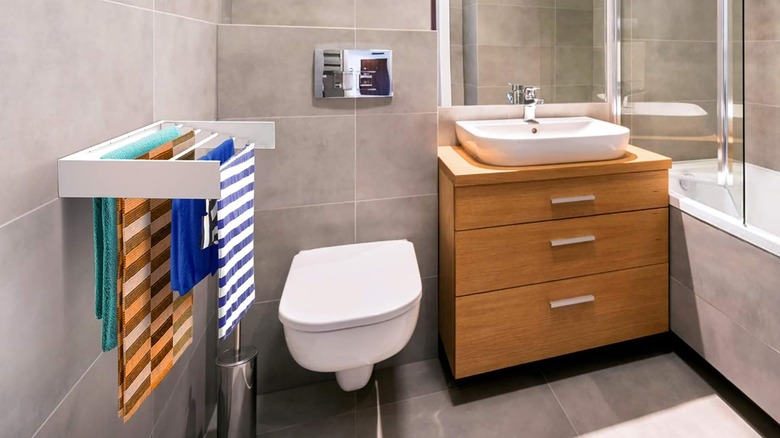 foldable towel rack in a bathroom