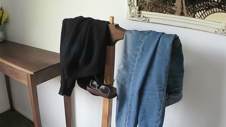 wooden clothes valet in use