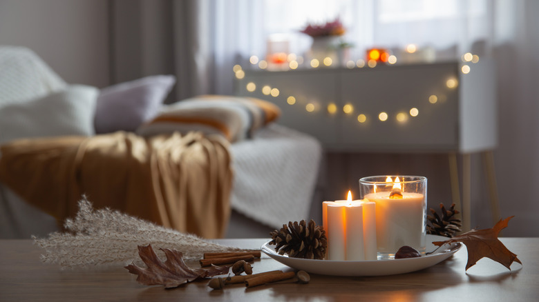 fall candle centerpiece on coffee table