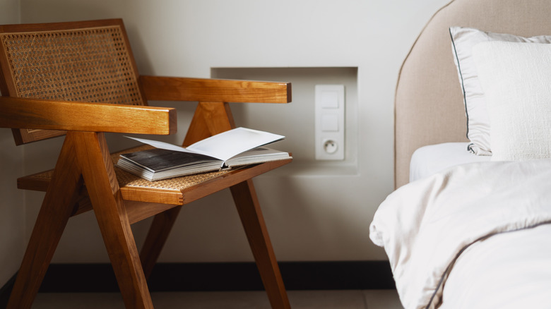 Rattan wooden chair by bed