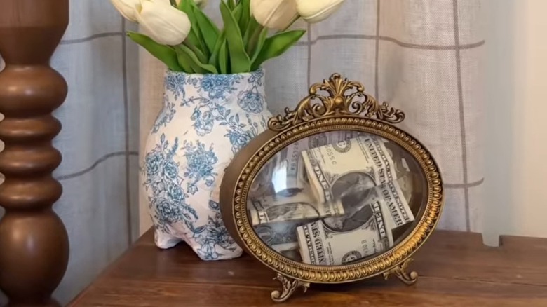 A clock refashioned into a place to store cash