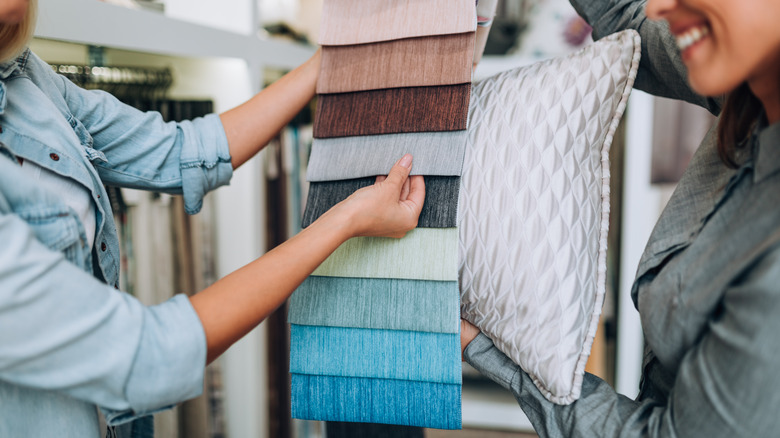 Person choosing cushion fabric