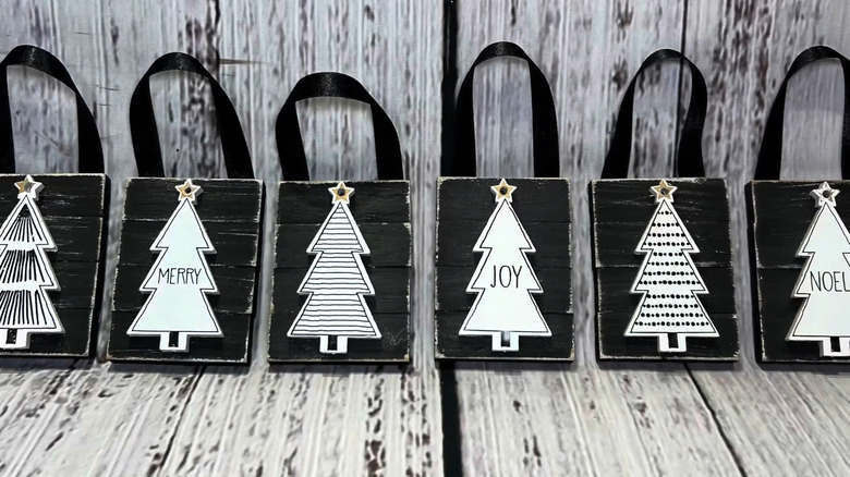 Row of ornaments made from Jenga pieces glued together