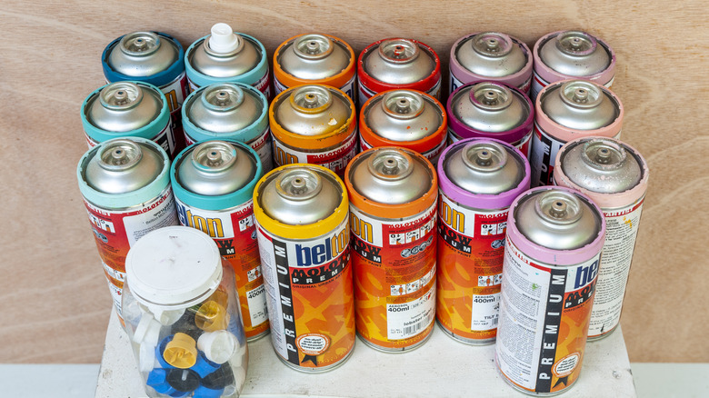 different coloured spray paint cans 