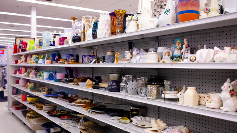 Shelves of ceramic and glass items at Goodwill
