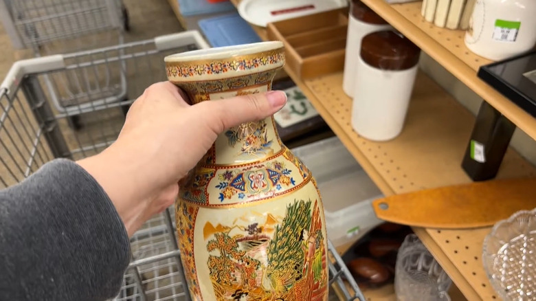 A close up of a vintage wooden cabinet at a thrift store.